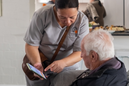 mobile frail carer taking care of an elderly client